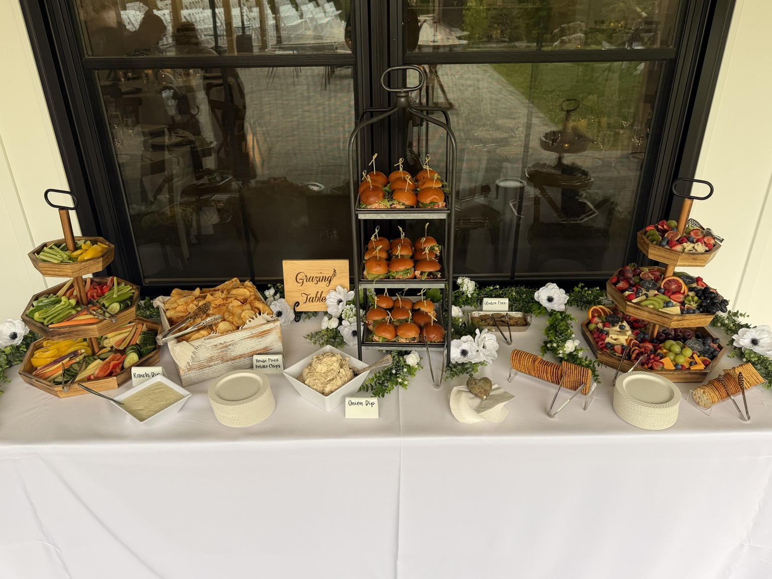 City Moose grazing table with sliders, vegetables, fruit, cheeses, and dips
